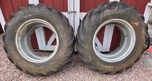 Used - 14.9 x 28 tires, tubes and rims, almost new, fits JD, MF and others --- $800/pair