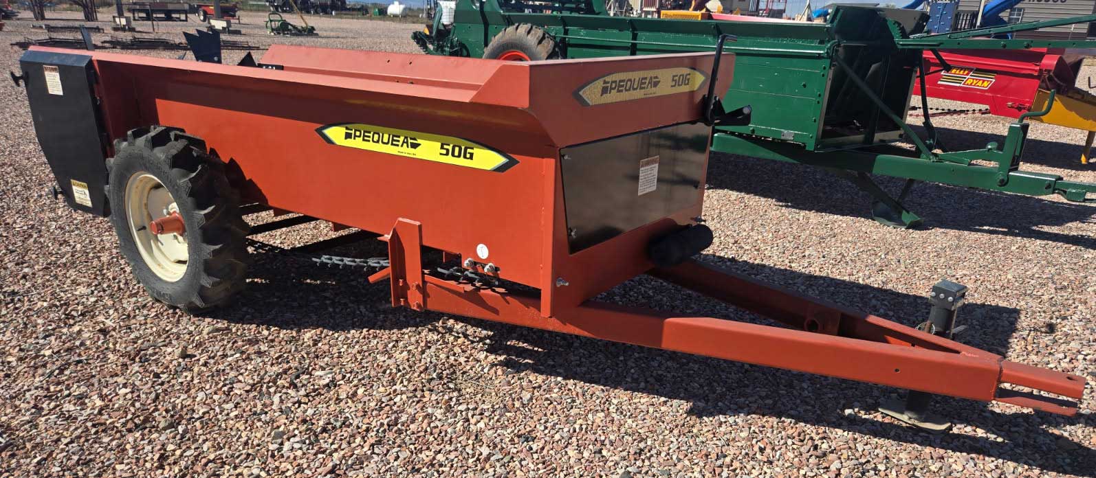USED--PEQUEA 50G MANURE SPREADER--GROUND DRIVEN, 50 BUSHEL, LOOKS UNUSED